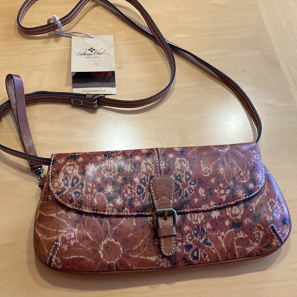 Ladies Patricia Nash crossbody bag. New with tags and cloth keeper bag inside .